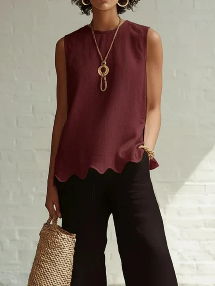 Women's sleeveless blouse featuring a scalloped hem and round neck, made from lightweight linen-style fabric for a relaxed fit, perfect for warm weather and casual 3