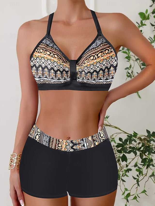 Womens bikini set featuring a halter top and short-style bottoms in a vibrant tropical print, perfect for beach days and summer vacations. 5