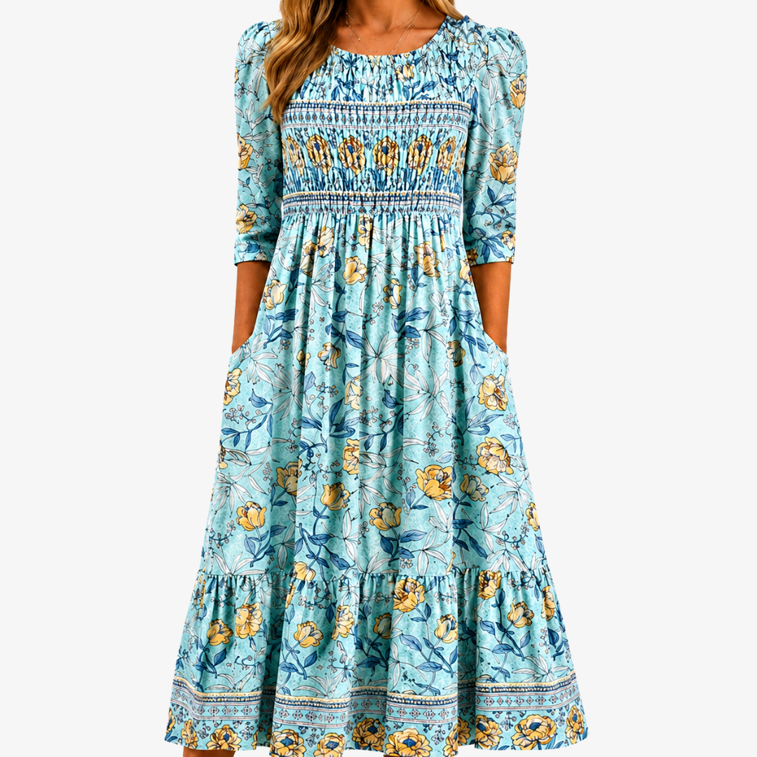 Aqua blue floral midi dress featuring a smocked bodice and a flowing skirt, perfect for spring and summer occasions. 0