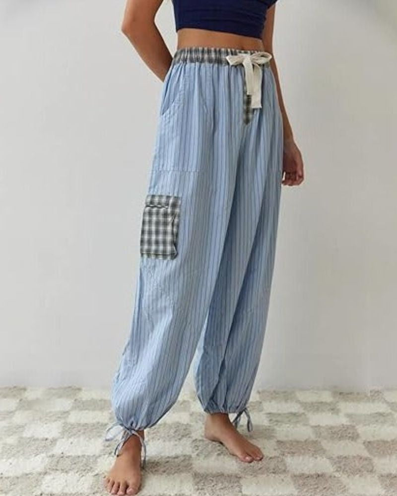 Womens pyjamas set featuring a relaxed fit, made from soft breathable fabric, with full-length trousers available in pink or blue. 8