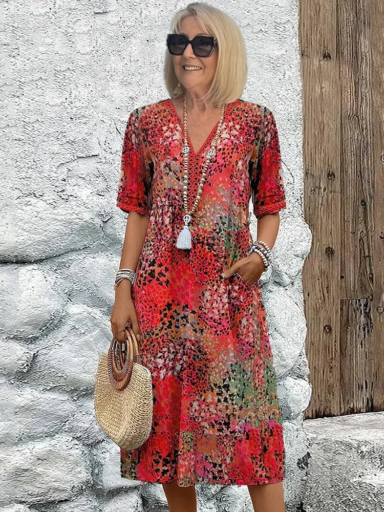 Womens summer dress featuring a V-neck design and vibrant floral pattern, knee-high length, comfortable fit, and plus sizes available for a stylish and flattering 0