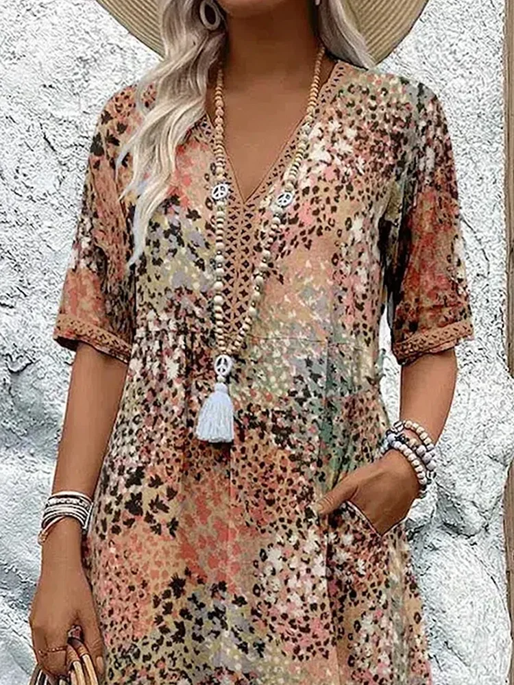 Womens summer dress featuring a V-neck design and vibrant floral pattern, knee-high length, comfortable fit, and plus sizes available for a stylish and flattering 5