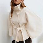 Belted black cape coat with stand collar and button closure, made from wool-style fabric for women, perfect for stylish winter layering. 3