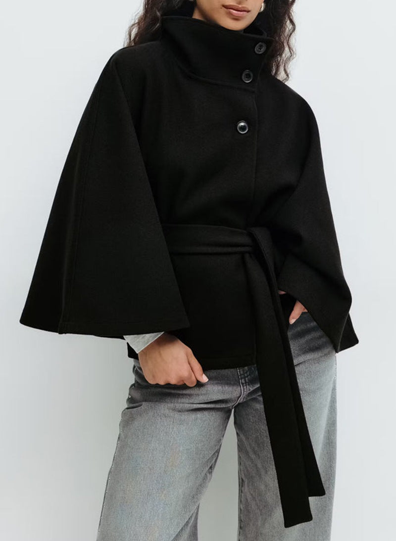 Belted black cape coat with stand collar and button closure, made from wool-style fabric for women, perfect for stylish winter layering. 4