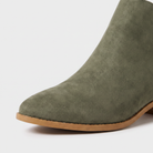 Black ankle boots for women featuring a stylish tasselled back zip, low stacked heel, and elegant V-front design, made from vegan material. 2