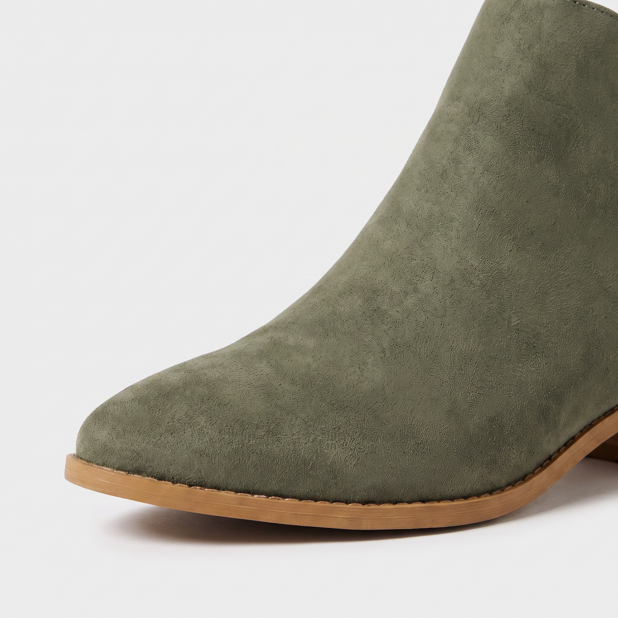 Black ankle boots for women featuring a stylish tasselled back zip, low stacked heel, and elegant V-front design, made from vegan material. 2