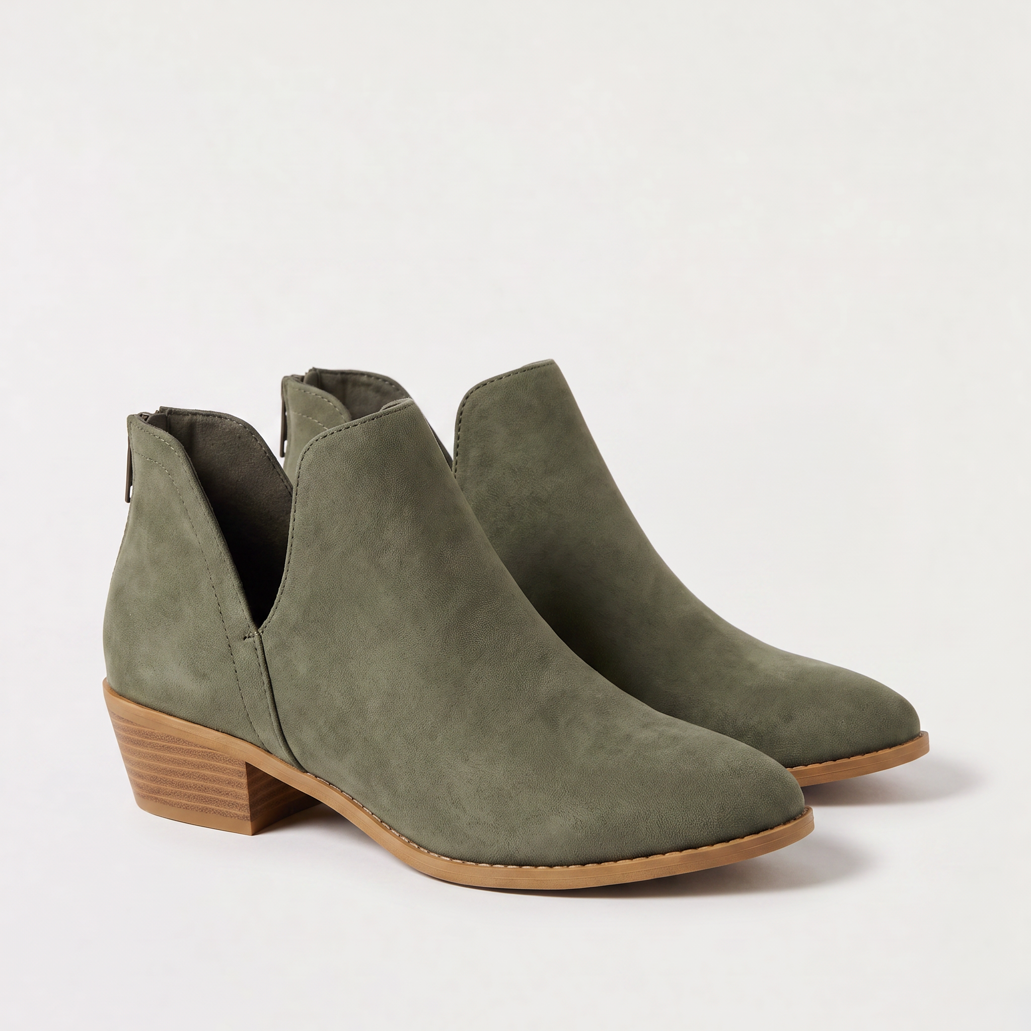 Black ankle boots for women featuring a stylish tasselled back zip, low stacked heel, and elegant V-front design, made from vegan material. 3