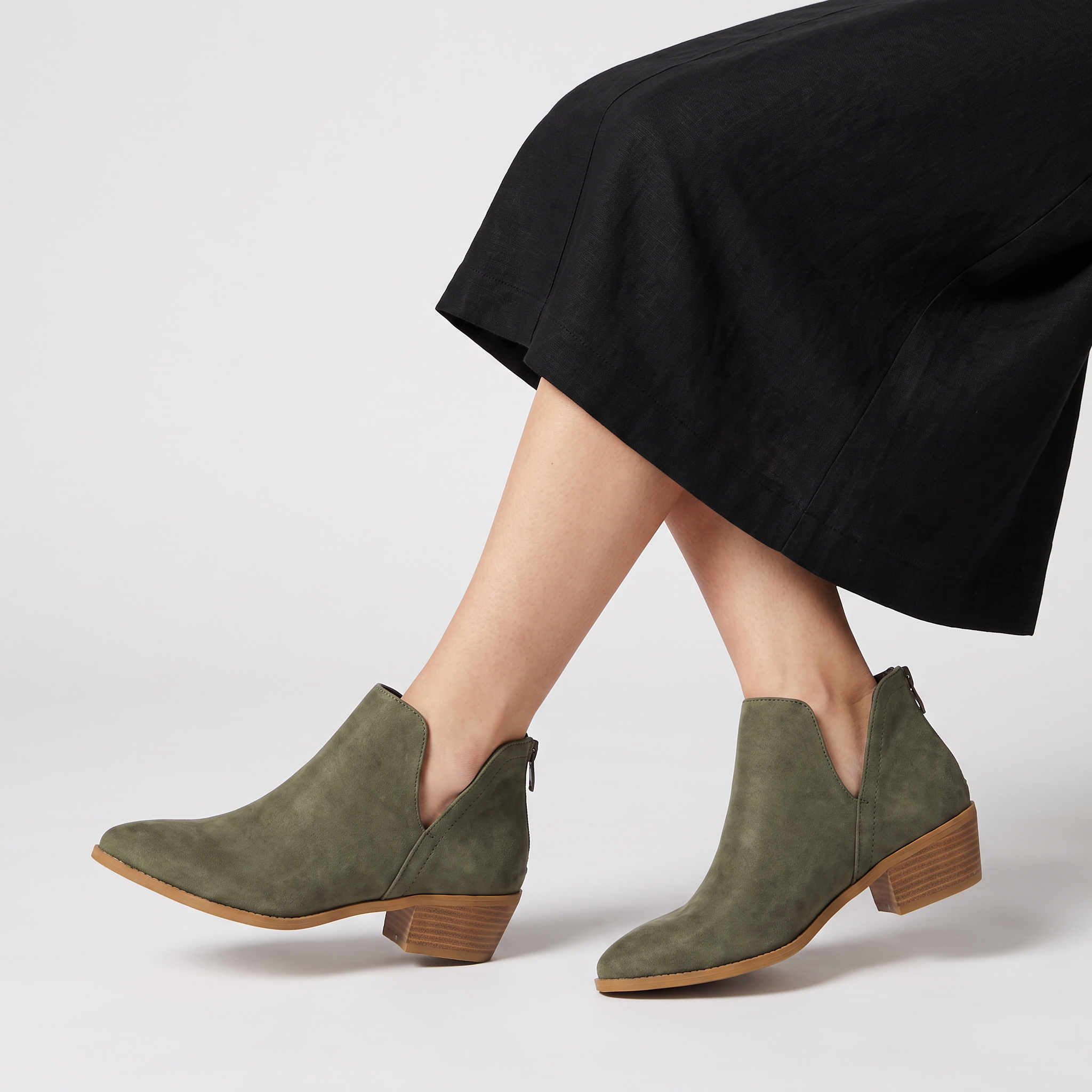 Black ankle boots for women featuring a stylish tasselled back zip, low stacked heel, and elegant V-front design, made from vegan material. 4