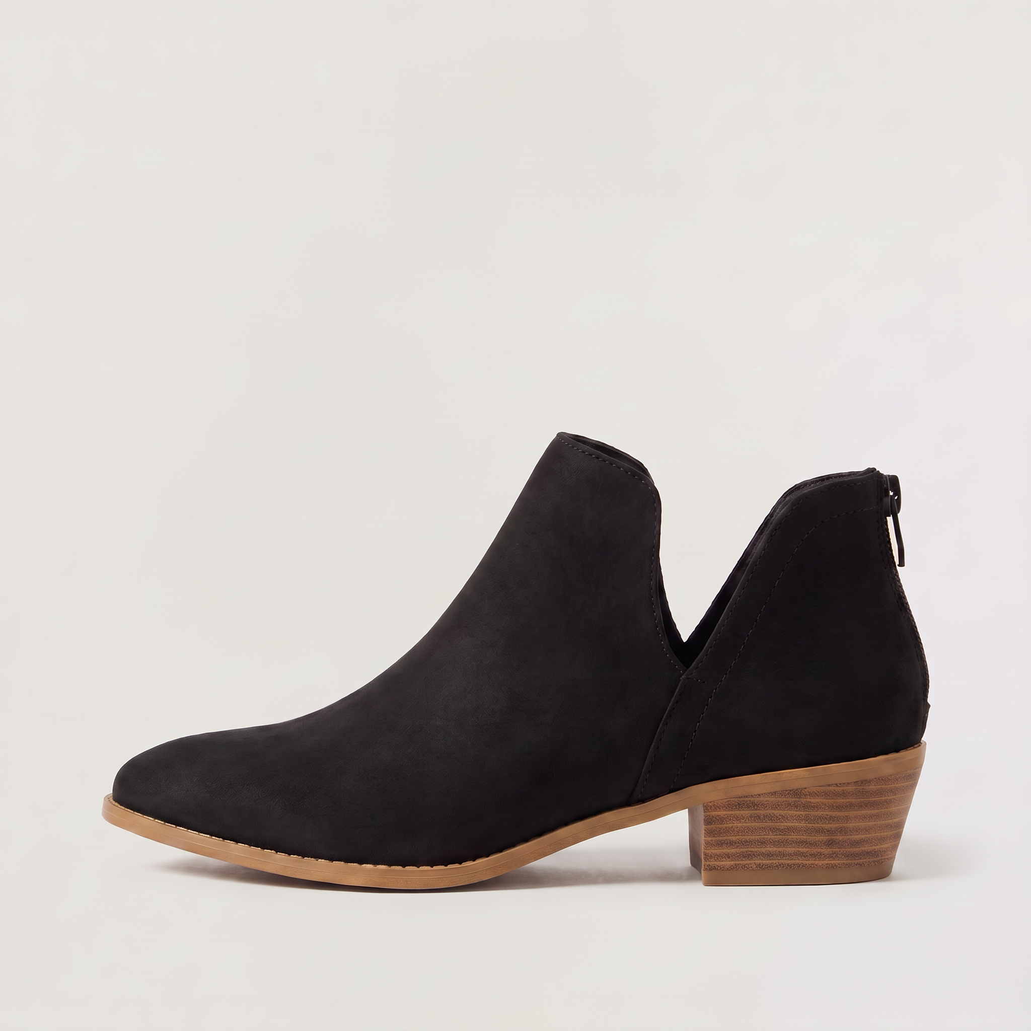Black ankle boots for women featuring a stylish tasselled back zip, low stacked heel, and elegant V-front design, made from vegan material. 7