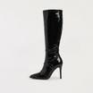 Black knee high boots featuring a sleek patent finish, inner zip closure, and stylish buckled straps, designed with elegant stiletto heels for women. 0