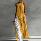 Boho maxi dress for women featuring a sleeveless A-line design, made from lightweight fabric, and designed with convenient pockets for summer outings. 0