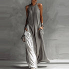 Boho maxi dress for women featuring a sleeveless A-line design, made from lightweight fabric, and designed with convenient pockets for summer outings. 1
