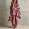 Boho vintage women's outfit featuring a stylish V-neck top and wide leg pants with a chic striped design, perfect for summer holidays. 0