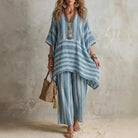 Boho vintage women's outfit featuring a stylish V-neck top and wide leg pants with a chic striped design, perfect for summer holidays. 1