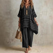 Boho vintage women's outfit featuring a stylish V-neck top and wide leg pants with a chic striped design, perfect for summer holidays. 2