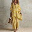 Boho vintage women's outfit featuring a stylish V-neck top and wide leg pants with a chic striped design, perfect for summer holidays. 3