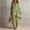 Boho vintage women's outfit featuring a stylish V-neck top and wide leg pants with a chic striped design, perfect for summer holidays. 4