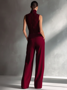 Burgundy jumpsuit for women featuring wide-leg trousers, made from a breathable cotton-linen blend with a sleeveless high neck design. 2