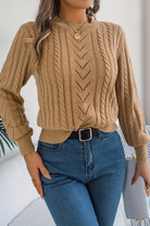 Cozy cable knit sweater for women featuring a stylish chevron pattern and trendy puff sleeves, perfect for fall and winter wear. 1