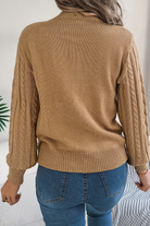 Cozy cable knit sweater for women featuring a stylish chevron pattern and trendy puff sleeves, perfect for fall and winter wear. 2