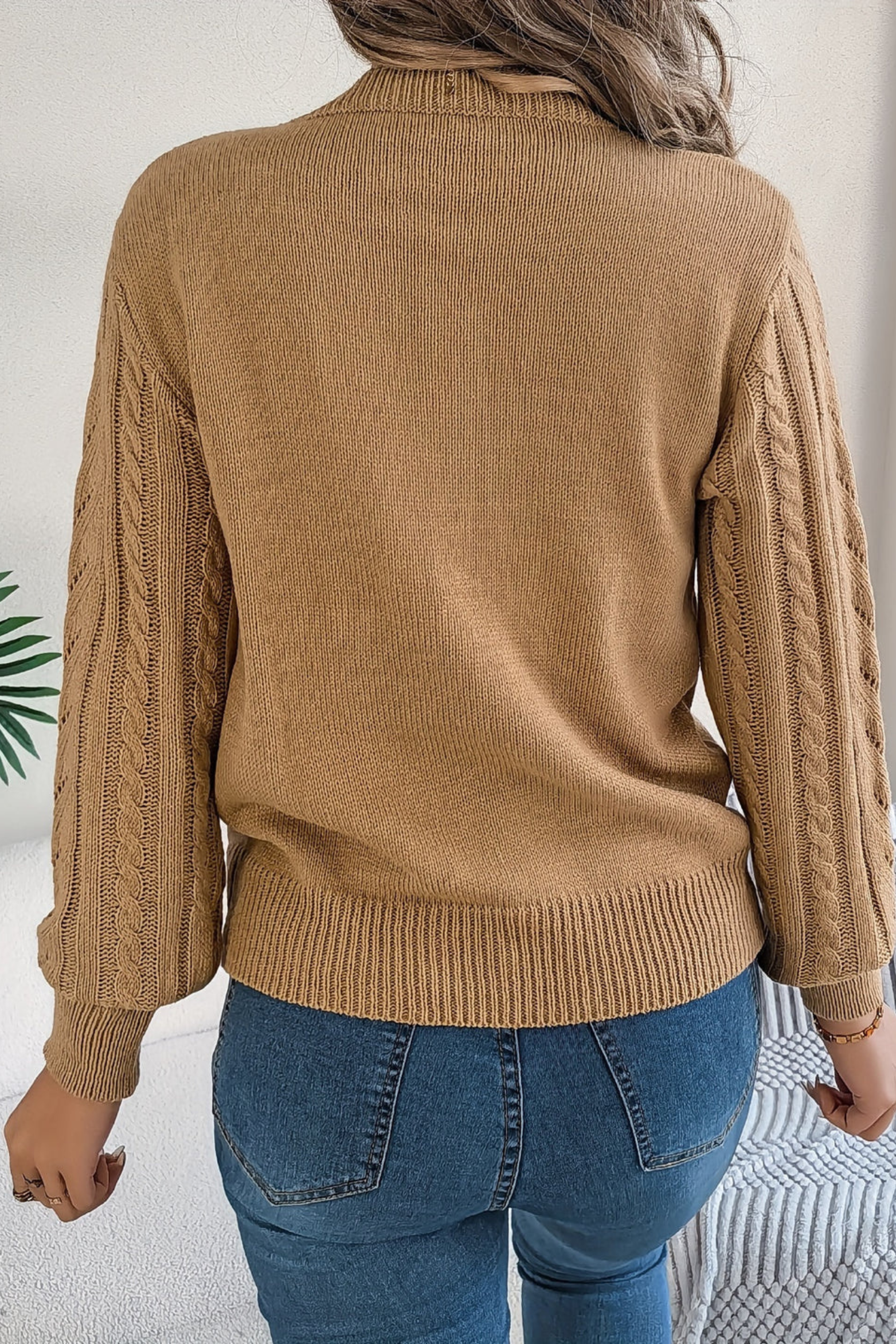 Cozy cable knit sweater for women featuring a stylish chevron pattern and trendy puff sleeves, perfect for fall and winter wear. 2