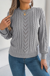 Cozy cable knit sweater for women featuring a stylish chevron pattern and trendy puff sleeves, perfect for fall and winter wear. 3