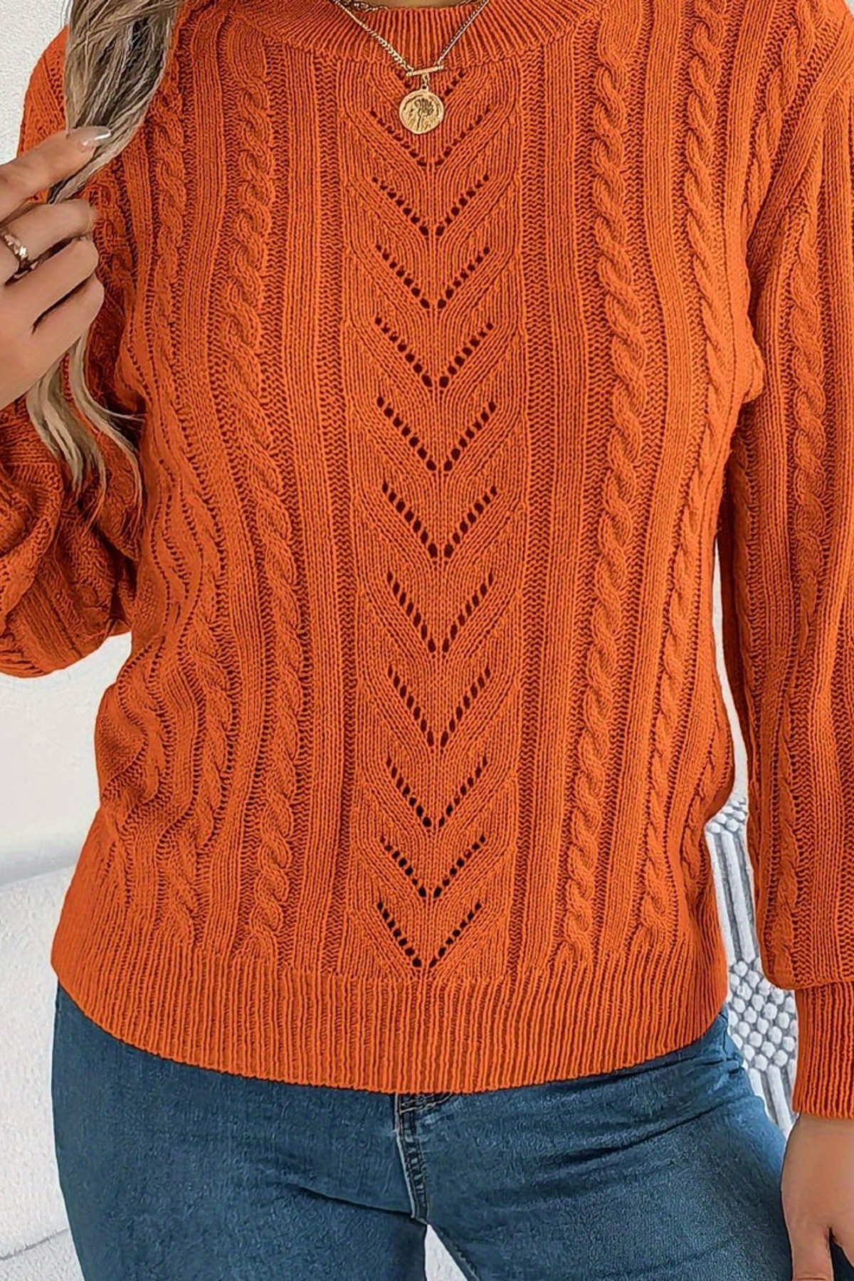 Cozy cable knit sweater for women featuring a stylish chevron pattern and trendy puff sleeves, perfect for fall and winter wear. 4