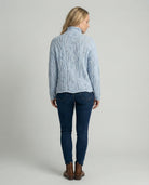 Soft chunky knit women's cable knit sweater featuring a cozy turtleneck and elegant pointelle detail, perfect for stylish winter layering. 1