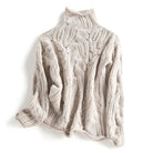 Soft chunky knit women's cable knit sweater featuring a cozy turtleneck and elegant pointelle detail, perfect for stylish winter layering. 3