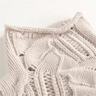 Soft chunky knit women's cable knit sweater featuring a cozy turtleneck and elegant pointelle detail, perfect for stylish winter layering. 4