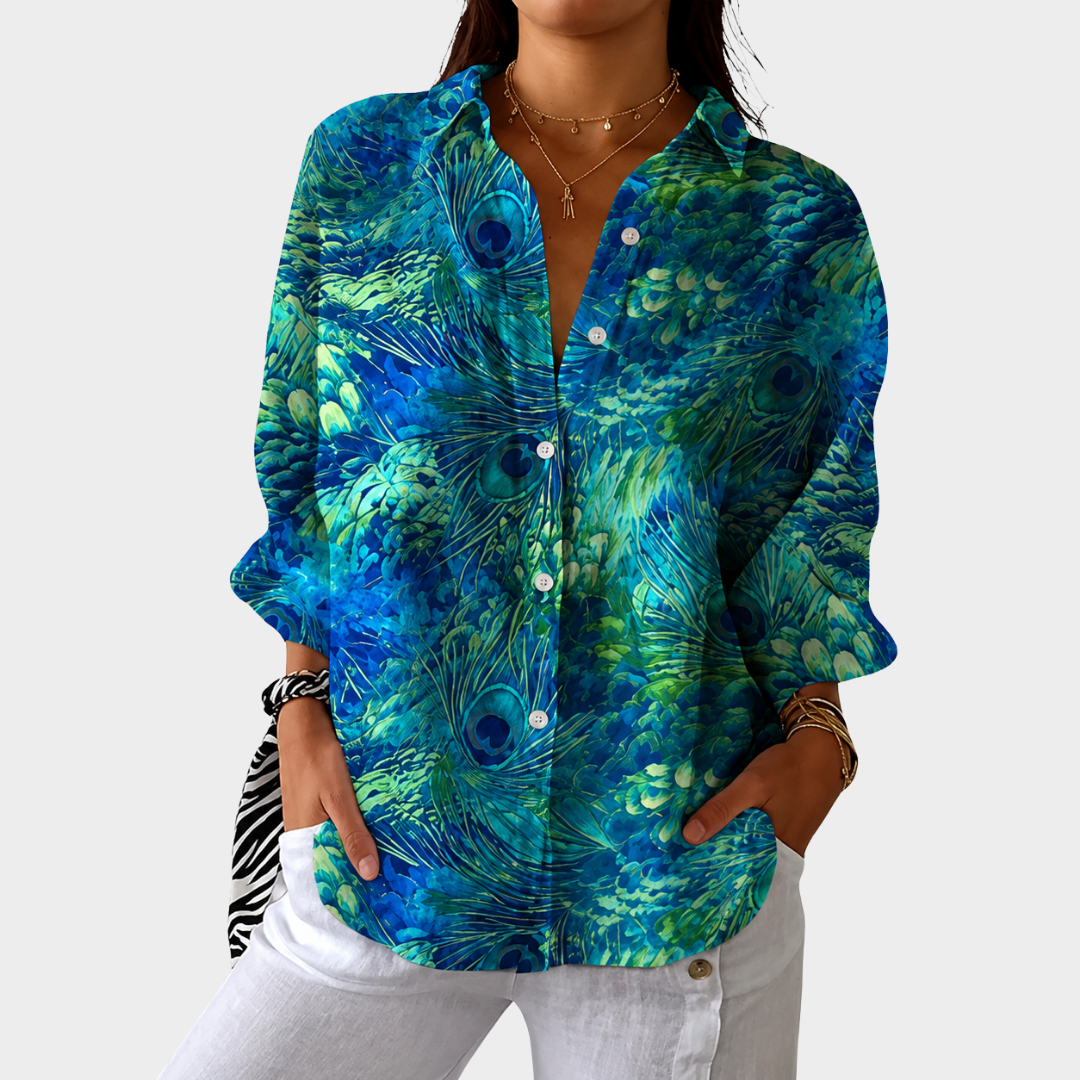 Colorful printed women's blouse with a loose fit, featuring a lightweight design perfect for summer wear. 0