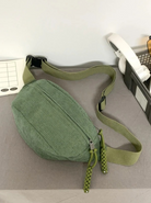 Corduroy crossbody bag in sage green featuring a crescent design and an adjustable strap, perfect for women’s casual style. 2