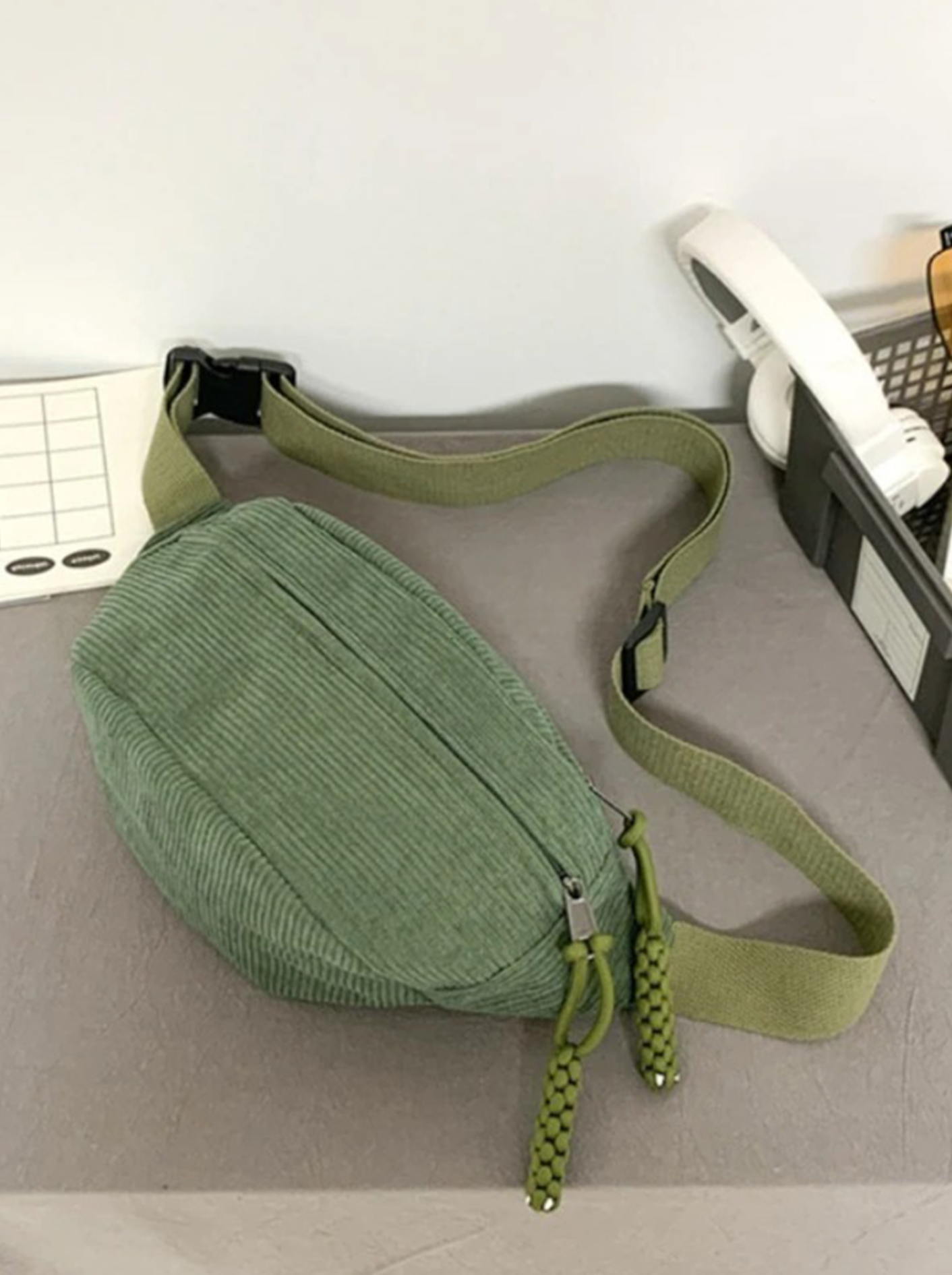 Corduroy crossbody bag in sage green featuring a crescent design and an adjustable strap, perfect for women’s casual style. 2