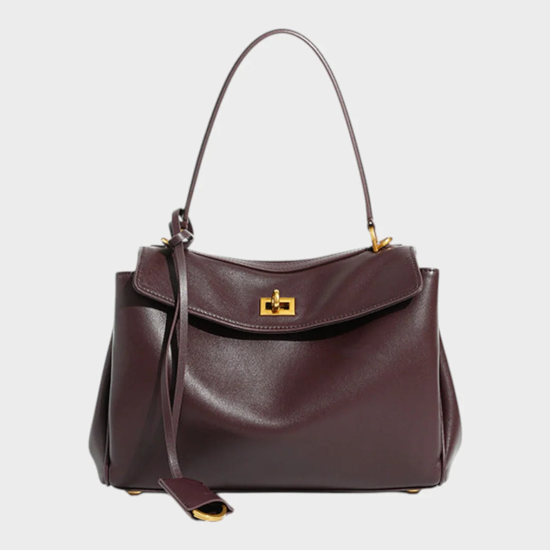 Cowhide leather shoulder bag featuring a magnetic flap closure and an adjustable strap, perfect for everyday use and versatile styling. 0