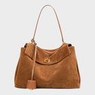 Cowhide leather shoulder bag featuring a magnetic flap closure and an adjustable strap, perfect for everyday use and versatile styling. 1