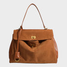 Cowhide leather shoulder bag featuring a magnetic flap closure and an adjustable strap, perfect for everyday use and versatile styling. 10