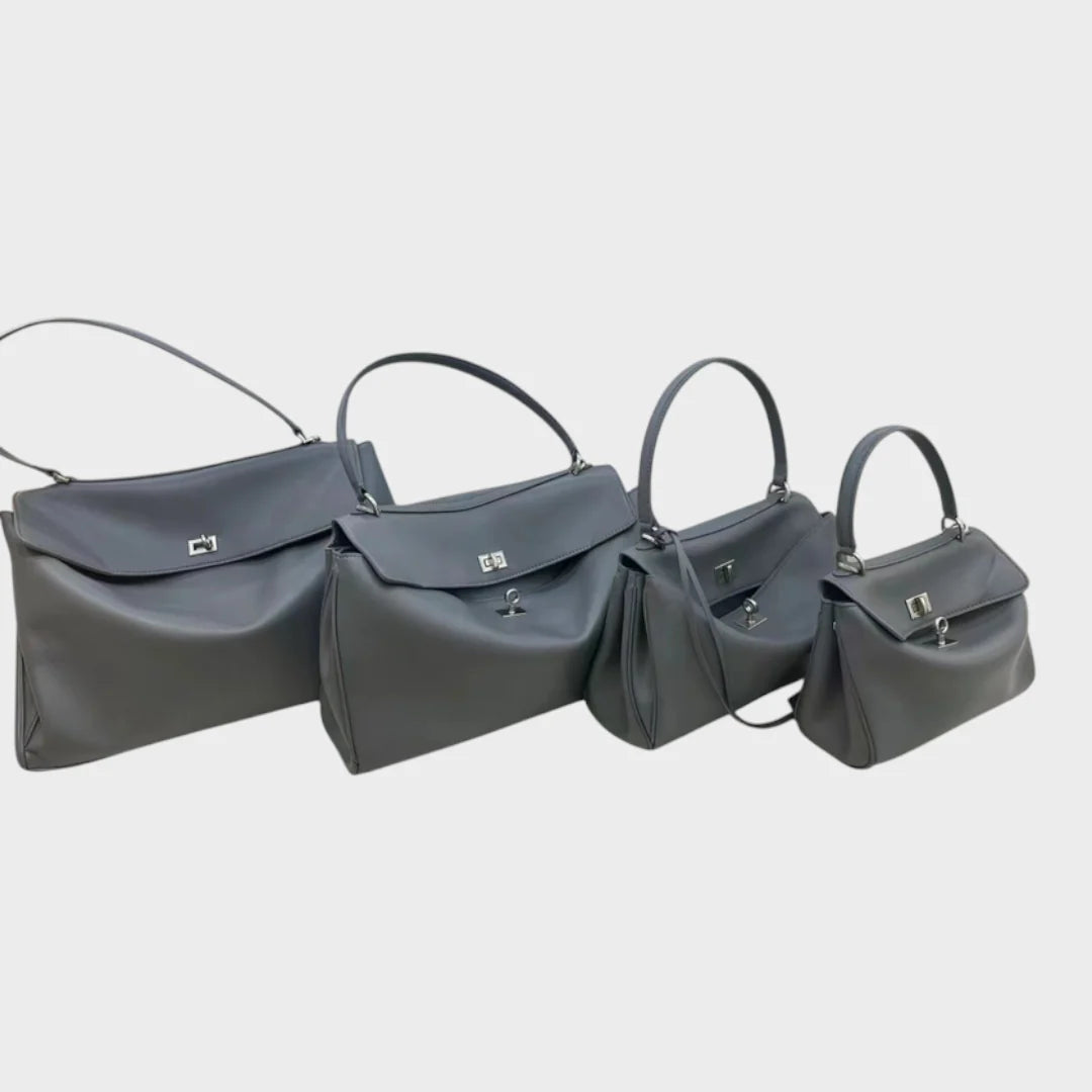 Cowhide leather shoulder bag featuring a magnetic flap closure and an adjustable strap, perfect for everyday use and versatile styling. 11