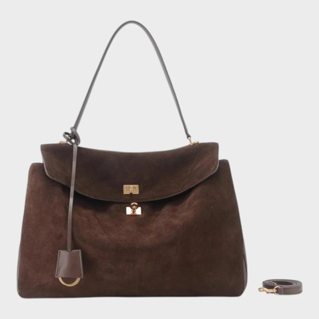 Cowhide leather shoulder bag featuring a magnetic flap closure and an adjustable strap, perfect for everyday use and versatile styling. 2