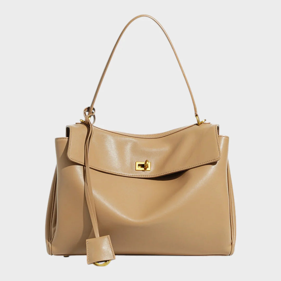 Cowhide leather shoulder bag featuring a magnetic flap closure and an adjustable strap, perfect for everyday use and versatile styling. 6