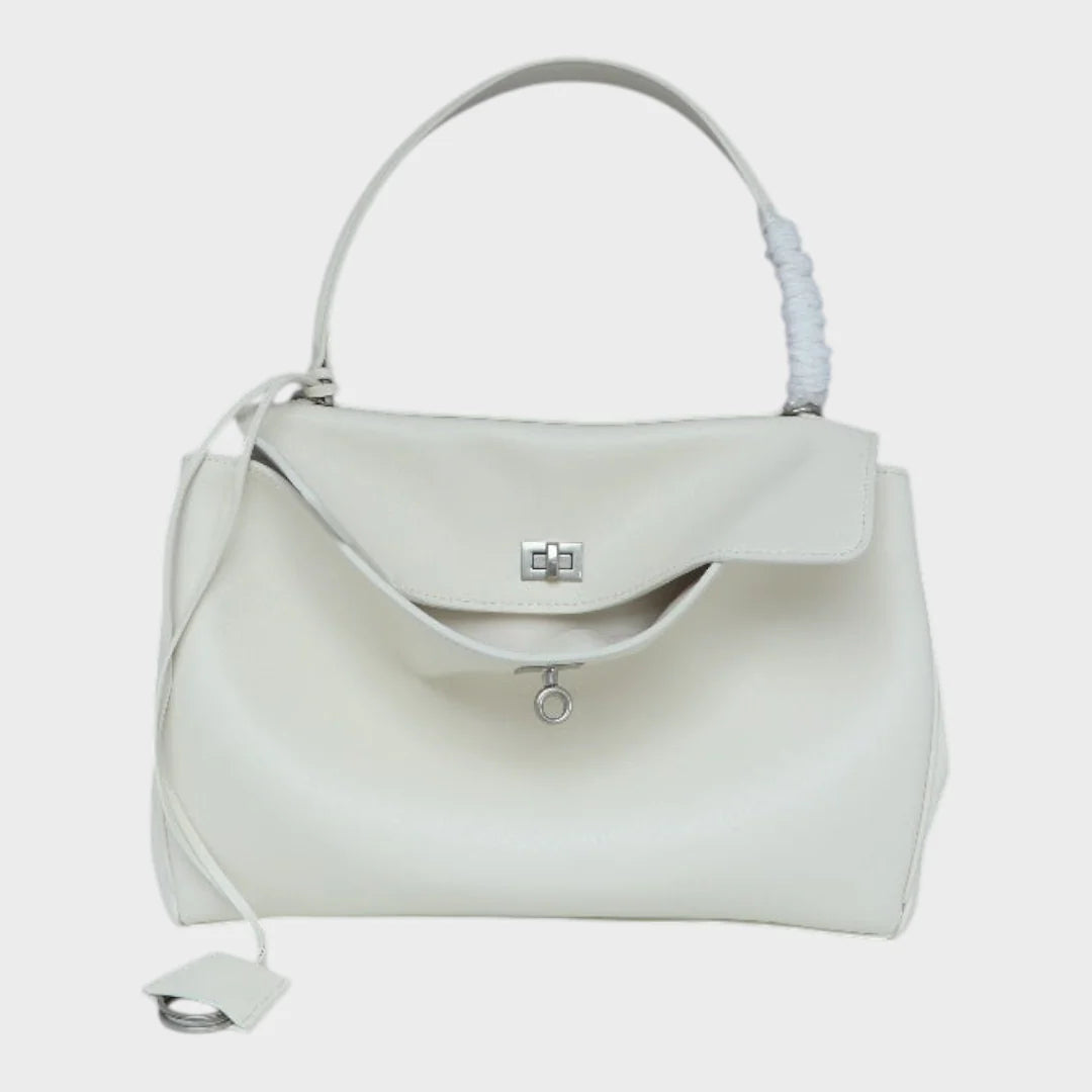 Cowhide leather shoulder bag featuring a magnetic flap closure and an adjustable strap, perfect for everyday use and versatile styling. 7