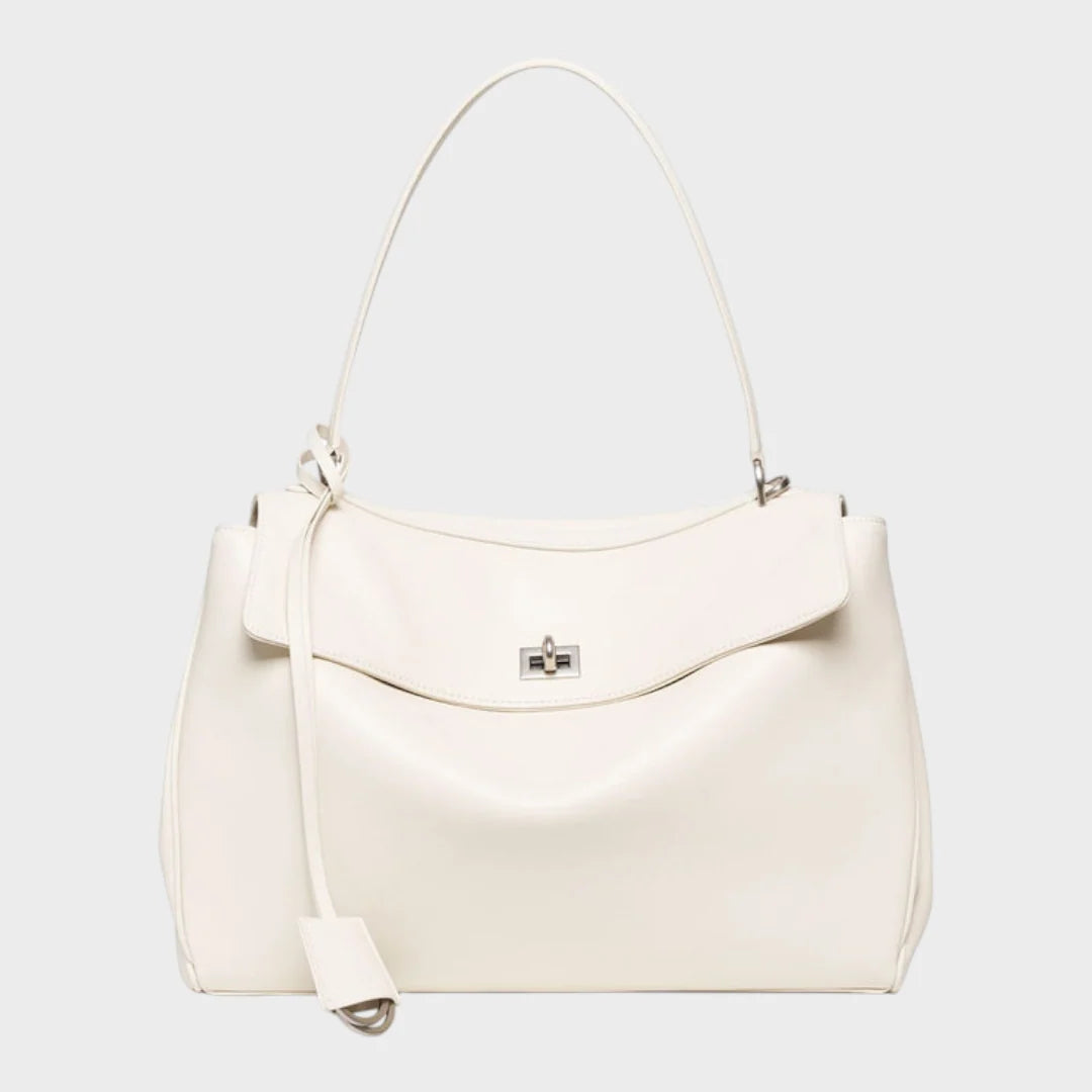 Cowhide leather shoulder bag featuring a magnetic flap closure and an adjustable strap, perfect for everyday use and versatile styling. 8