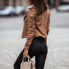 Cropped biker jacket for women featuring an asymmetric zip and lapel collar in a soft suede-style finish. 4