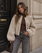 Cropped bomber jacket for women featuring a zip-up front and soft lightweight fleece design, perfect for stylish layering in cool weather. 3