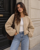 Cropped bomber jacket for women featuring a zip-up front and soft lightweight fleece design, perfect for stylish layering in cool weather. 5