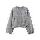 Cropped bomber jacket for women featuring a zip-up front and soft lightweight fleece design, perfect for stylish layering in cool weather. 8