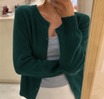 Cropped cardigan sweater for women featuring a button front and round neckline, made from soft cashmere-feel knit for ultimate comfort and style. 10