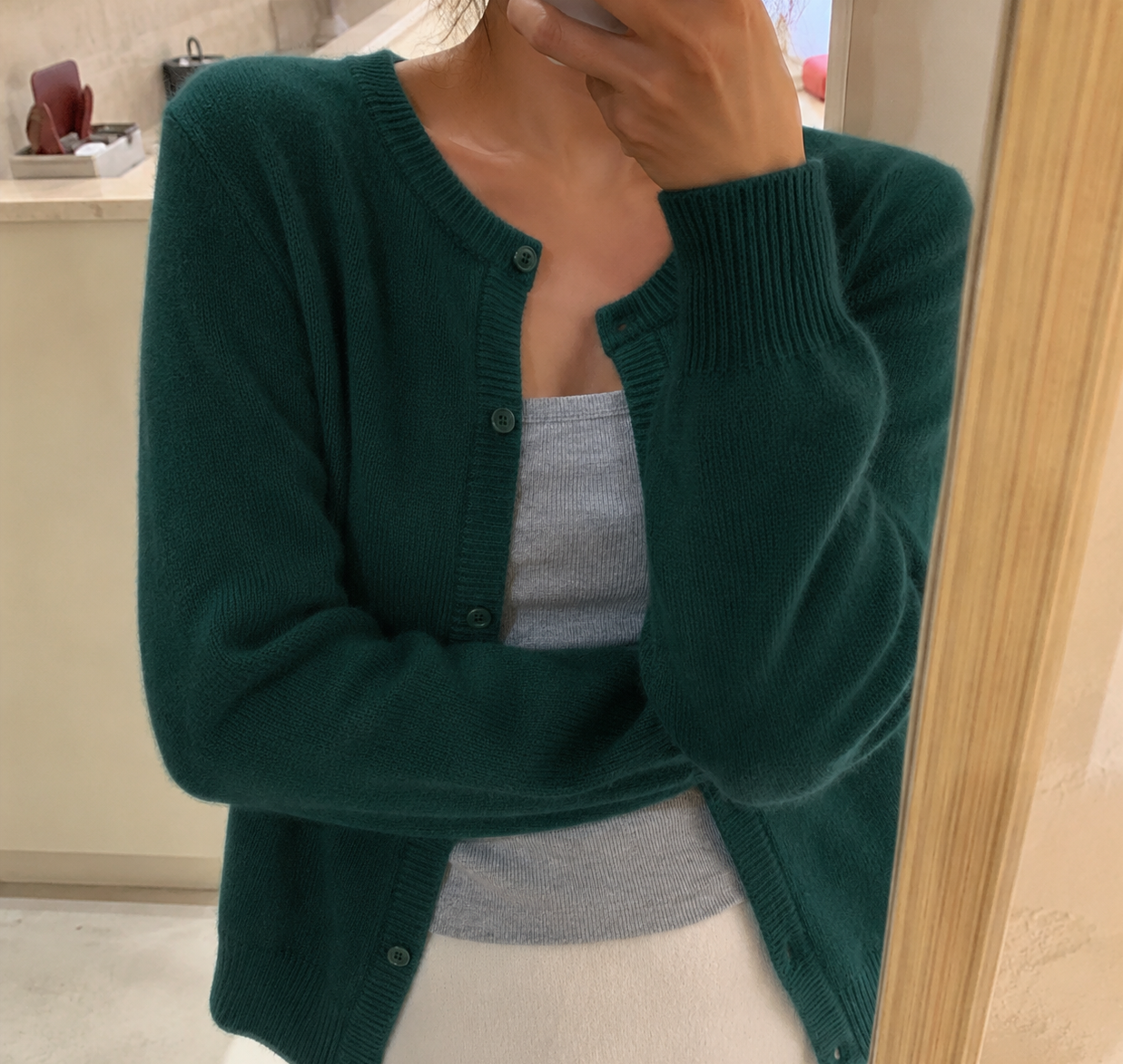 Cropped cardigan sweater for women featuring a button front and round neckline, made from soft cashmere-feel knit for ultimate comfort and style. 10