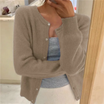 Cropped cardigan sweater for women featuring a button front and round neckline, made from soft cashmere-feel knit for ultimate comfort and style. 4
