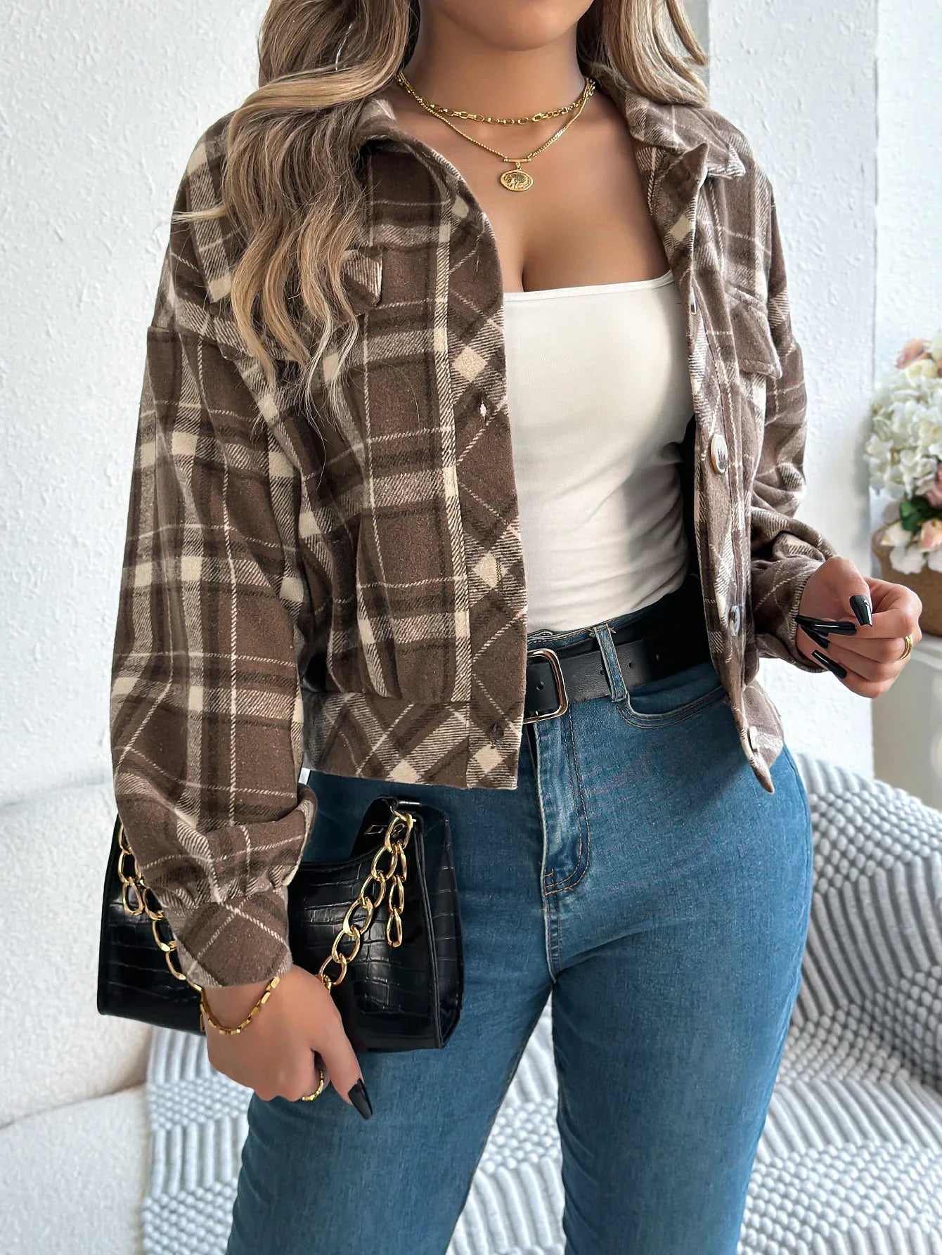 Cropped plaid shacket for women featuring a button front and chest pockets, made from soft flannel for a casual layered look. 0