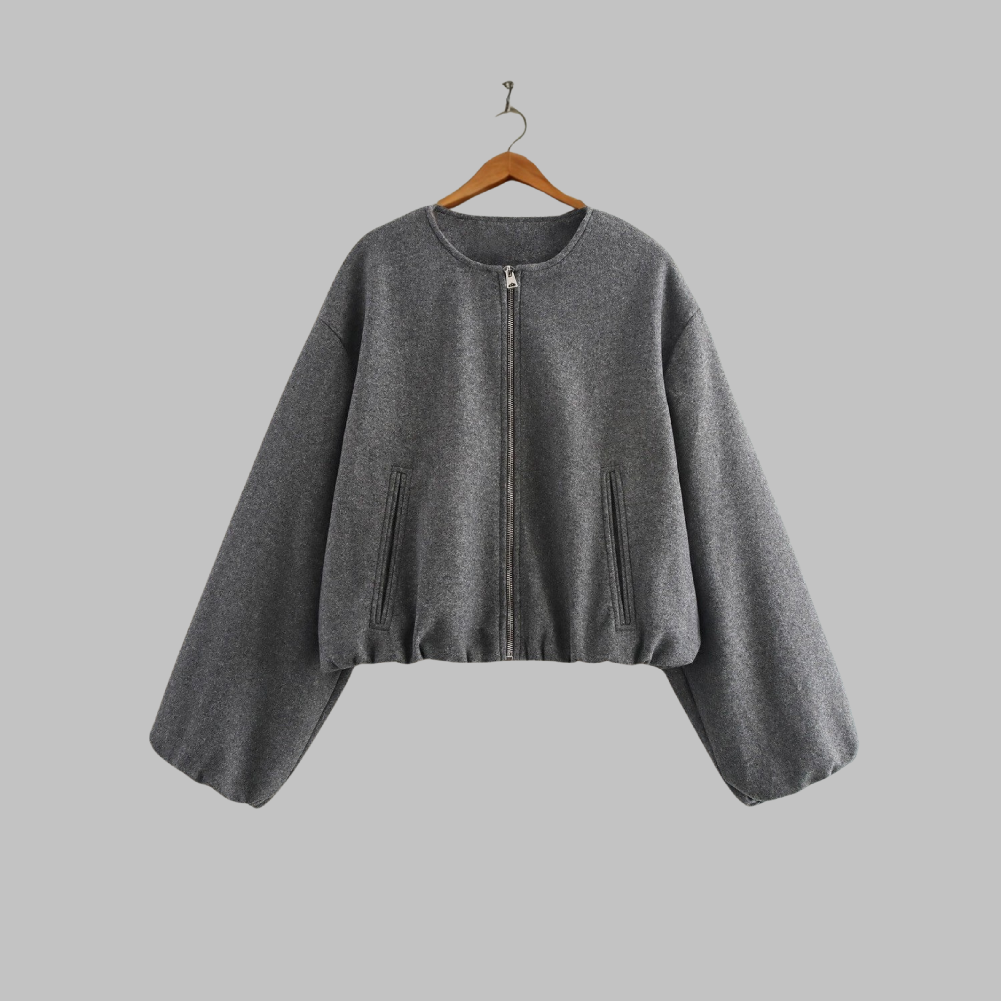 Cropped zip jacket with collarless neckline in soft structured design, perfect for a stylish and modern look. 0